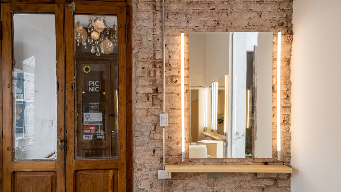 Mirror on an exposed brick wall